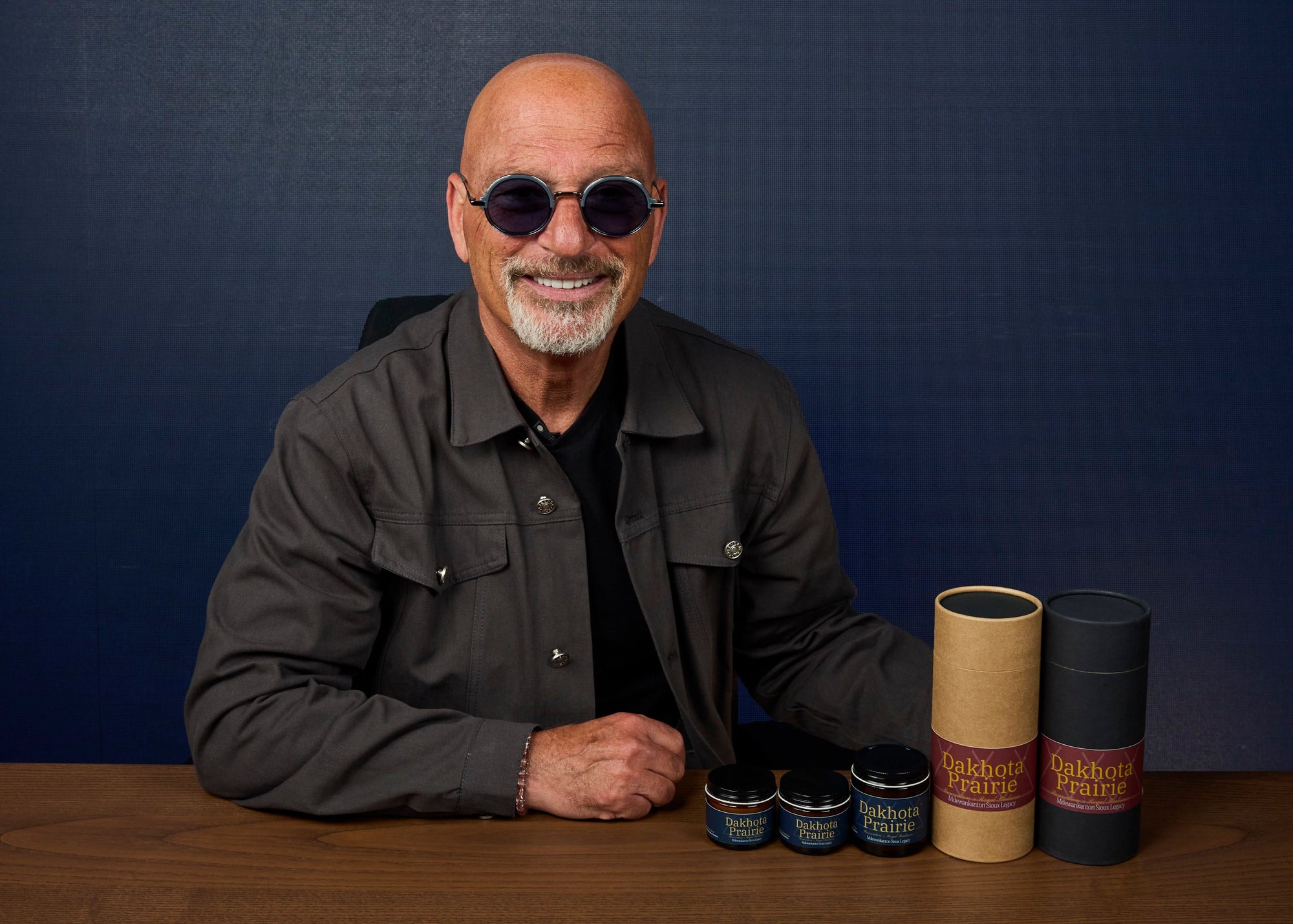 Howie Mandel sitting with the Luxe Renewal Set